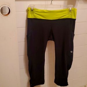 Lululemon black and neon yellow crop running pants size 6.